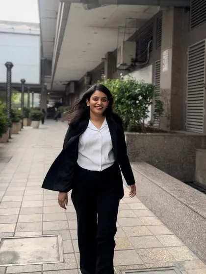 In motion, jacket flying, embracing the fast pace of a litigator's life. I am always ready to fight for a bail hearing or argue a criminal case.