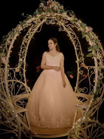 A fairytale moment in a Cinderella style carriage. Our light pink ball gown is the perfect rental for a princess themed shoot.