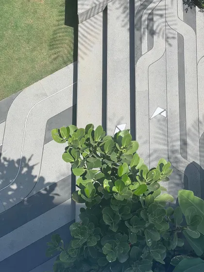 The finished floor pattern with sunlight casting shadows, showing how the design comes to life and interacts with its environment.