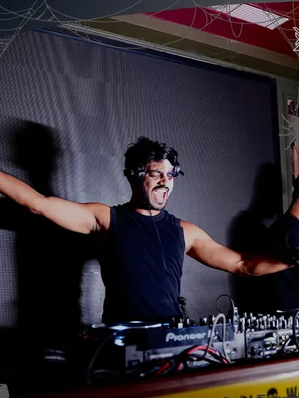 Arms wide open, bringing the energy to a Halloween party. Themed events are a chance to get creative with both the music and the look.
