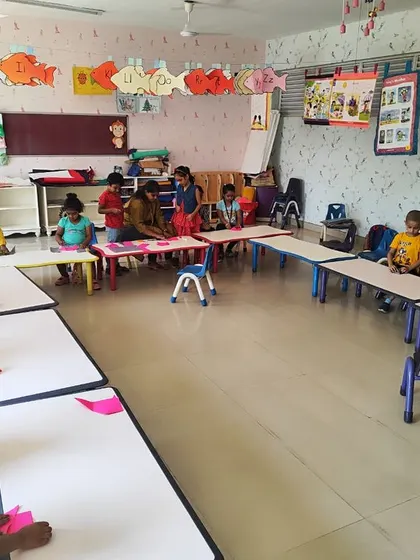 A wide view of the craft classroom, where students are engaged in making origami, fostering creativity and focus.