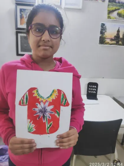 Kanvika from our PP2 batch with her floral T-shirt design. She used a bold red background to make the central flower and patterned sleeves stand out.