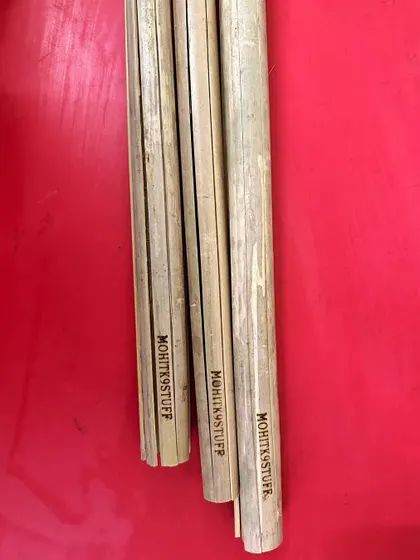 Another shot of the branded clatter sticks. The bamboo is chosen for its ability to create a sharp, loud clattering sound that is effective for training.