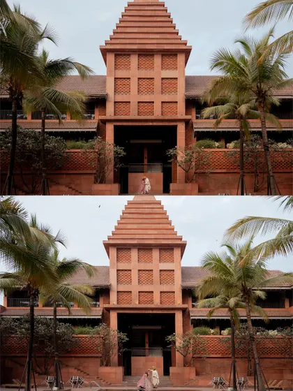 The grand scale of the destination wedding venue is captured in this architectural shot, with the couple standing together, small against the magnificent structure, symbolizing the start of their big journey.