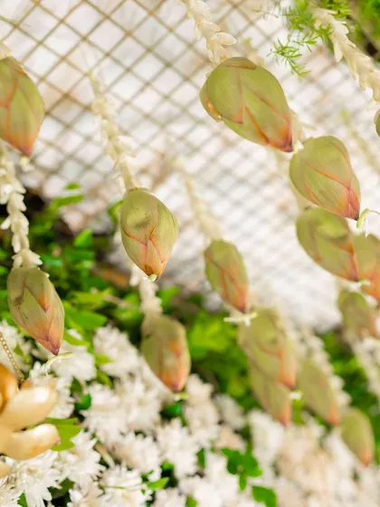 A detailed shot of hanging lotus buds, a traditional element that adds a touch of grace and authenticity to the decor.