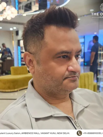 The only grooming session you need. This client's haircut is a sharp, modern style with a high fade and textured top.