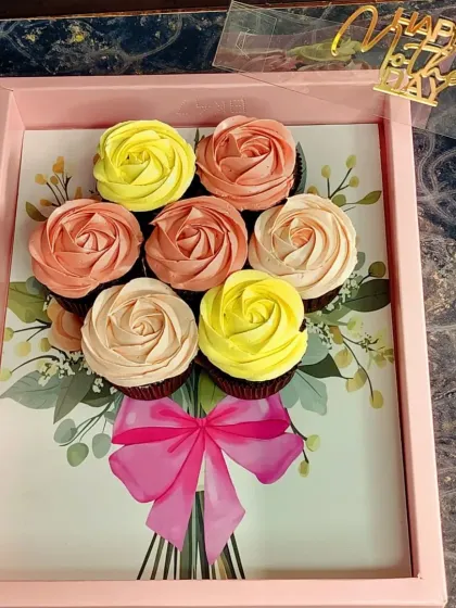 My cupcake bouquets are a popular gift for any celebration. This Mother's Day version features seven chocolate cupcakes with hand-piped buttercream roses, arranged beautifully in a gift tray.