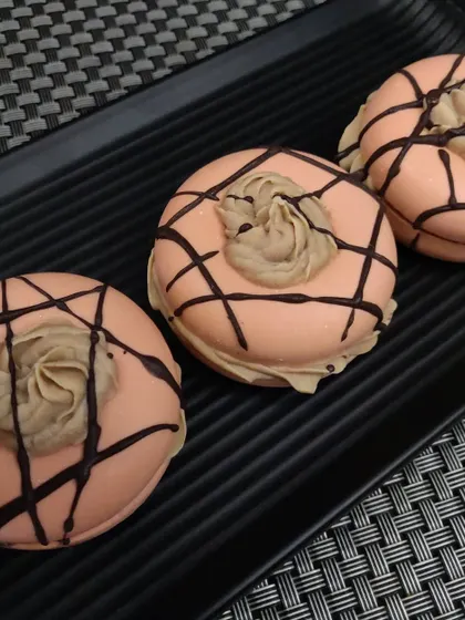 This is a cold process donut soap, made with nourishing oils like olive and coconut oil. The whipped soap topping and chocolate drizzle make it look like a decadent coffee-flavored treat.
