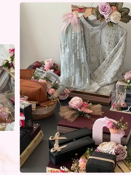 A beautiful display of trousseau packaging for both the bride and groom. The coordinated colors and floral arrangements ensure that the gift exchange looks as beautiful as the ceremony itself.