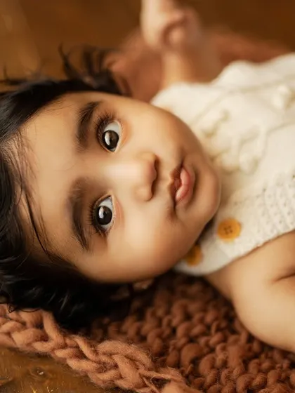 A beautiful close-up of a baby's face, full of expression and wonder. These are the moments you'll want to remember forever.