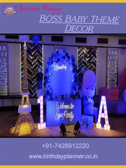 This is another variation of the Boss Baby theme decor from image 18, emphasizing the cool blue lighting and modern props.