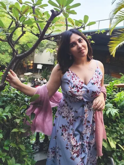 Surrounded by greenery, feeling content. This picture captures the soft, joyful energy I'm carrying with me.