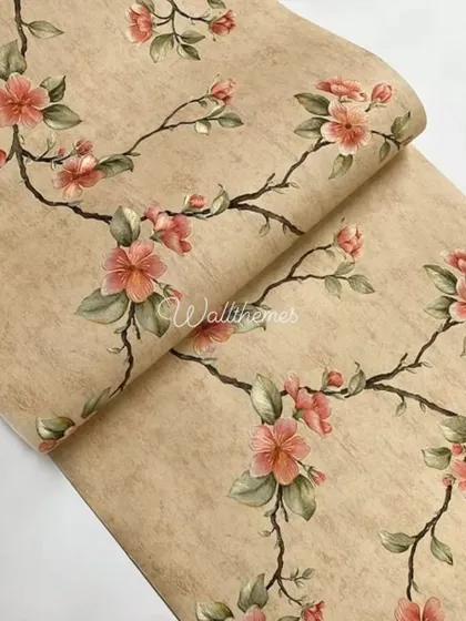 A close-up of a wallpaper roll with a pattern of delicate pink flowers on beige branches.