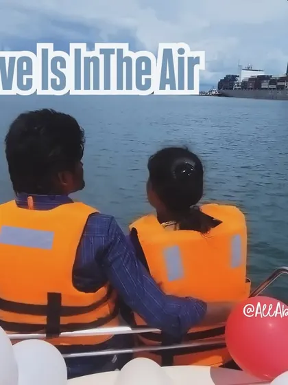 Love is in the air, and on the sea. A couple enjoying a quiet moment on their private yacht, decorated with balloons for the special occasion.
