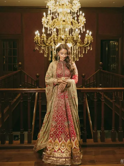 A full-length view of the bride's magnificent anarkali. The intricate embroidery and regal silhouette make this a show-stopping look for a Sufi night.