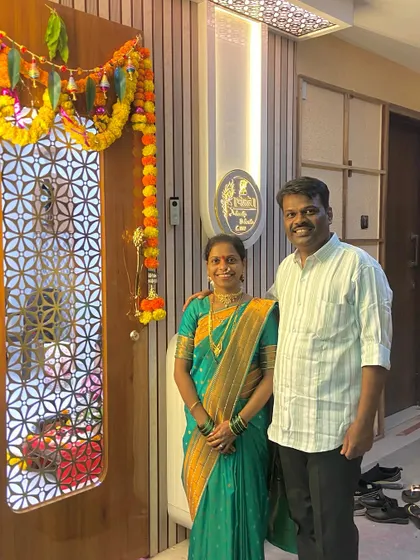 The Bhosle family at the beautifully decorated entrance of their new 1BHK home in Badlapur East, ready for their Griha Pravesh.