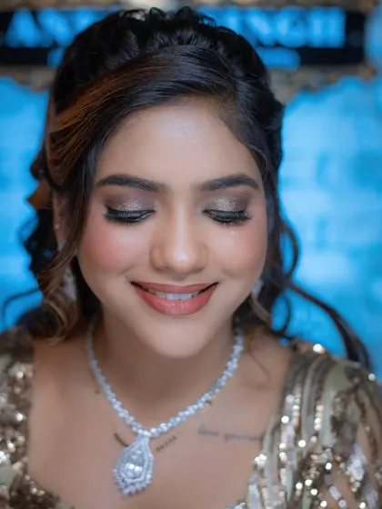 A smiling close-up that shows how a well-executed glam look can still appear soft and beautiful.