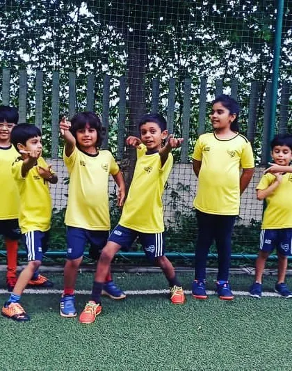 A group of our youngest players striking a pose. We encourage them to be confident and have fun.