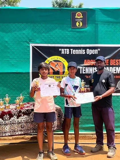 The boys' doubles winners proudly display their trophies at the ATB Tennis Open.