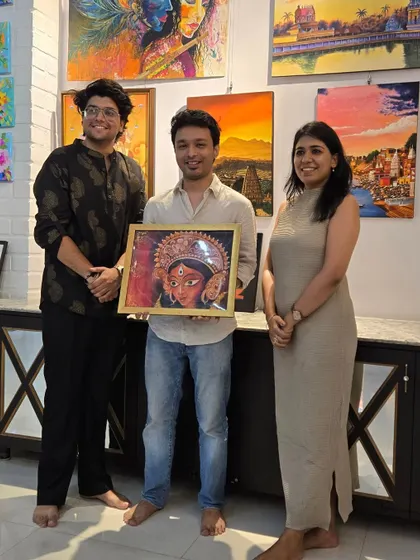 The happy collectors of a Durga painting by artist Simran, pictured with our curator. We are delighted to see this powerful piece find its new home.