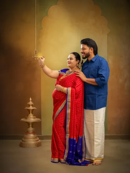 Lighting the lamp together symbolizes the start of a new life. This shot captures a traditional ritual, filled with hope and blessings for the journey into parenthood.