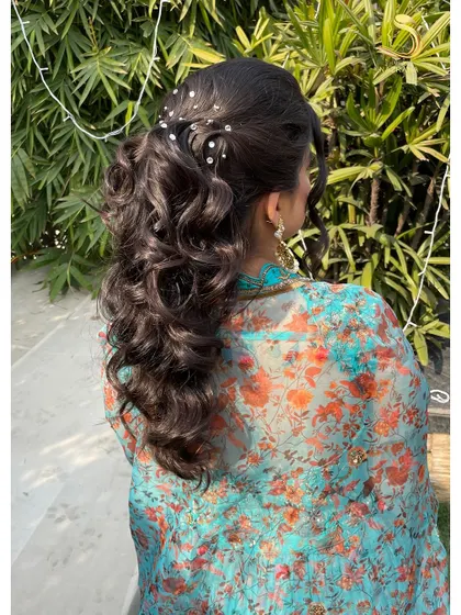 This angle showcases the height and shape of the textured ponytail, designed to be flattering and stay in place all day.