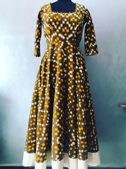 This unique Anarkali was created from an ikat weave saree. The full-flair design showcases the fabric's pattern, and I added a simple border for a clean finish.