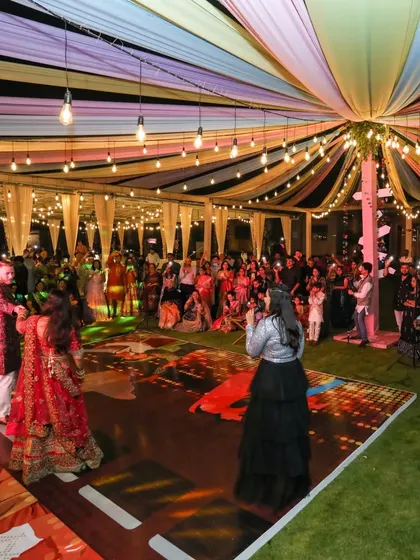 The Sangeet is a time for friends and family to shine. We set up a dedicated performance stage with a custom floor, giving everyone the perfect platform to dance their hearts out and celebrate the couple.