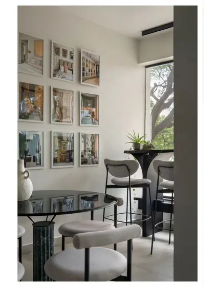 A cozy corner in our studio, Ruh HQ. This space, with its gallery wall of our projects, is where we meet, brainstorm, and dream up new ideas.