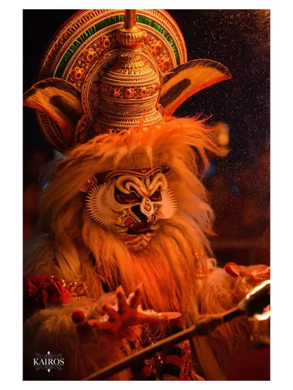A dramatic portrait of a performer lit by fire, capturing an intense and primal energy.