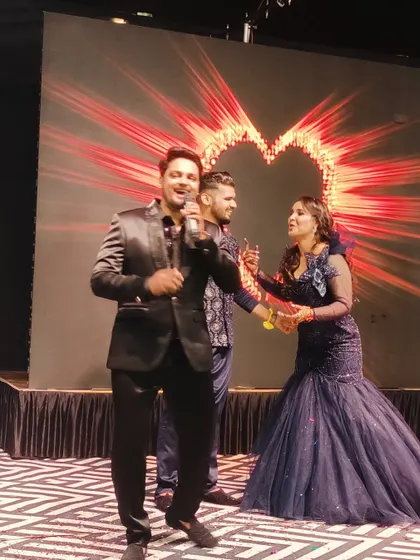 A candid moment of joy on the reception stage with the happy couple. My goal is to create a comfortable and fun atmosphere where everyone can be themselves.