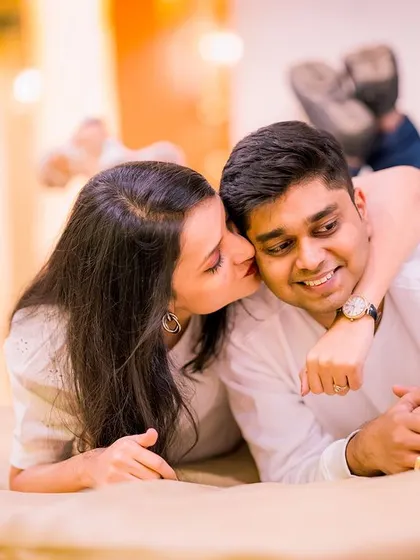 A cozy and intimate indoor shot. This photo captures a playful and affectionate moment, showing that beautiful portraits can be simple and natural.