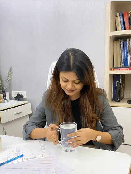 A candid moment at my desk. Behind the scenes, my day is filled with reviewing patient cases, planning treatments, and staying on top of the latest dermatological research.