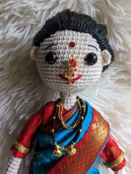 A close-up showing the delicate nath and mangalsutra.
