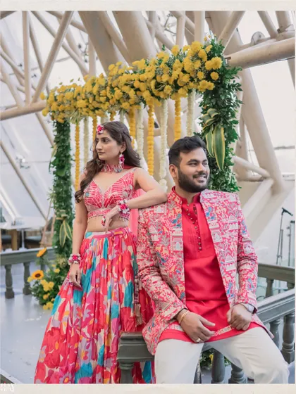 A stylish pose from the couple, showing off their coordinated and colorful Haldi outfits.