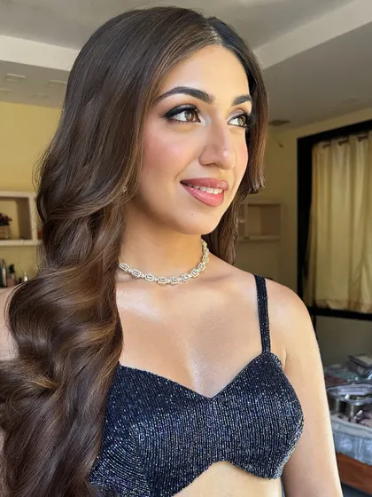 A three-quarter profile of Sheena. This angle shows off the soft contouring and the beautiful shape of her eye makeup.