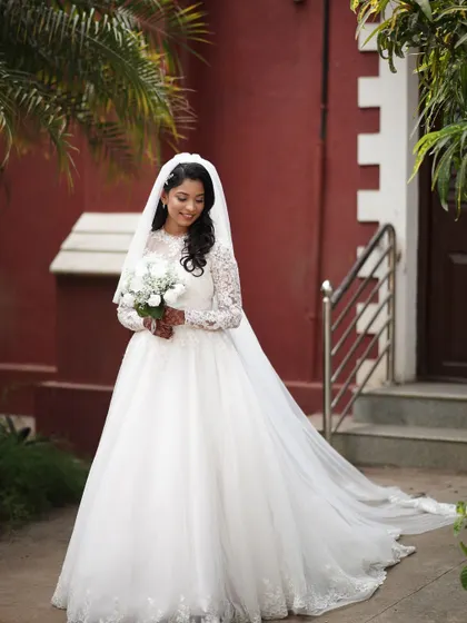 Creating this elegant look for a beautiful church wedding was a joy. I aimed for a timeless and romantic style with soft makeup and classic waves, ensuring the bride felt radiant and comfortable in her stunning white gown.