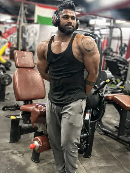 Gain, not bulk. A tricep pose showing the quality muscle I've added.