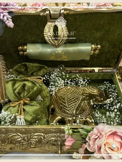 This is where royalty meets relationship building. A glimpse inside one of my Rajwada-style chests, featuring a detailed golden elephant and treats wrapped in velvet potlis. I design these to offer a truly 'shahi tajurba' or a royal experience for your most important clients and employees.