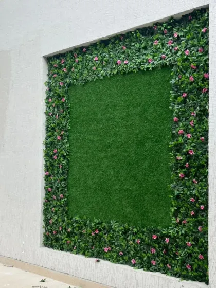 A closer look at the green wall frame in Himachal. I used a mix of green leaves and small pink flowers for the border to add a touch of color and make the design pop.