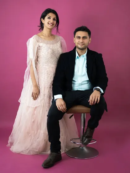 A duplicate of image 81, this portrait captures the parents looking stylish and happy. It's a great reminder of the couple at the heart of the family.