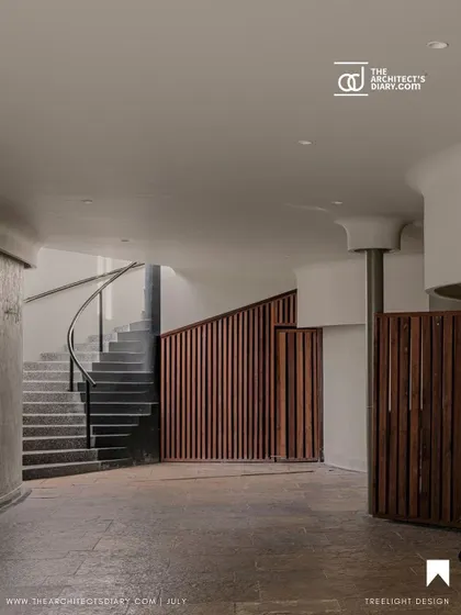 The interior of the Aqua Spa features a curved staircase and vertical wooden slats that echo the fluid forms of the exterior. The design guides visitors through a journey that evokes a profound sense of serenity.