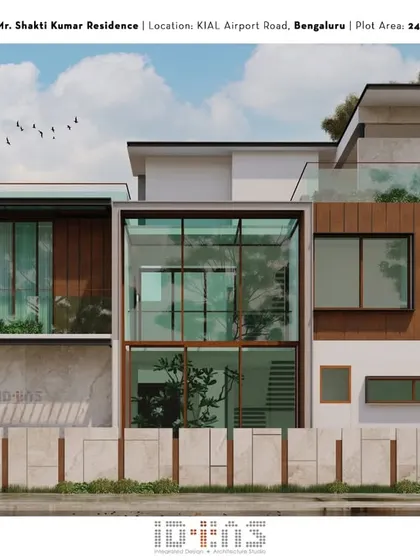 Another perspective of the Shakti Kumar residence, showing the glass-covered pergola and the layering of materials that give the facade its modern character.