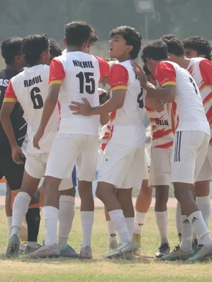 A team huddle before the game. Unity and strategy are key to our success.