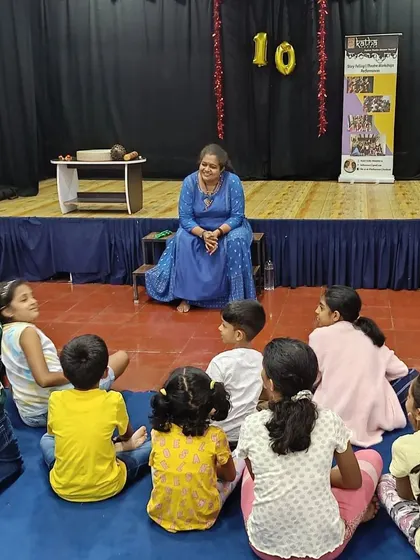 Me, sitting with the children during a storytelling session at Kappanna Angala. My simple stories often leave both children and parents with something to think about.