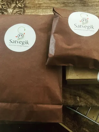 A sneak peek of a day's delivery orders. This image shows my flourless lentil bread, almond walnut nutritional bars, and 'Date Sneakers', all packed in my signature eco-friendly brown paper packaging.