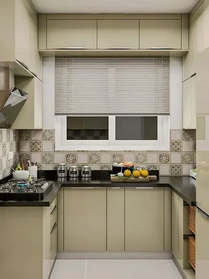A small yet highly functional U-shaped kitchen. The design incorporates overhead cabinets and a patterned tile backsplash to add character without overwhelming the space.