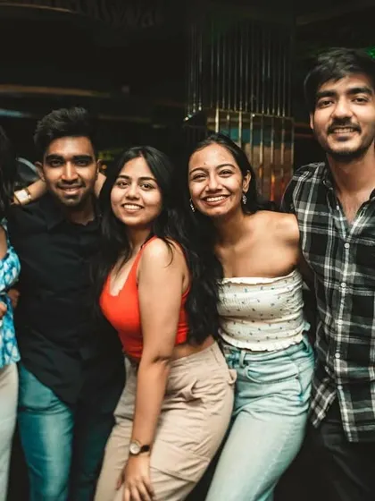A group of friends enjoying their Sunday night out. This is the kind of vibrant energy you can expect every week.