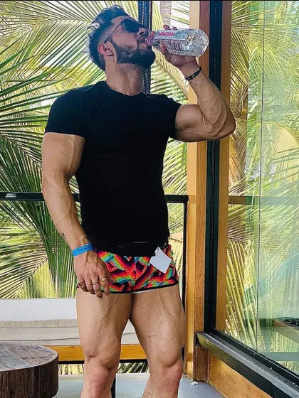 Hydration is key. Taking a moment to refuel during a break from training. Proper nutrition and hydration are just as important as the workout itself.