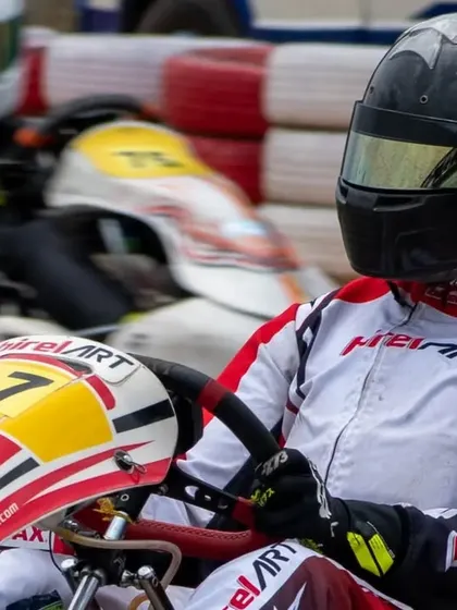 In the pre-grid, our driver remains focused amidst the competition. Mental preparation is a key component of our comprehensive driver management services.